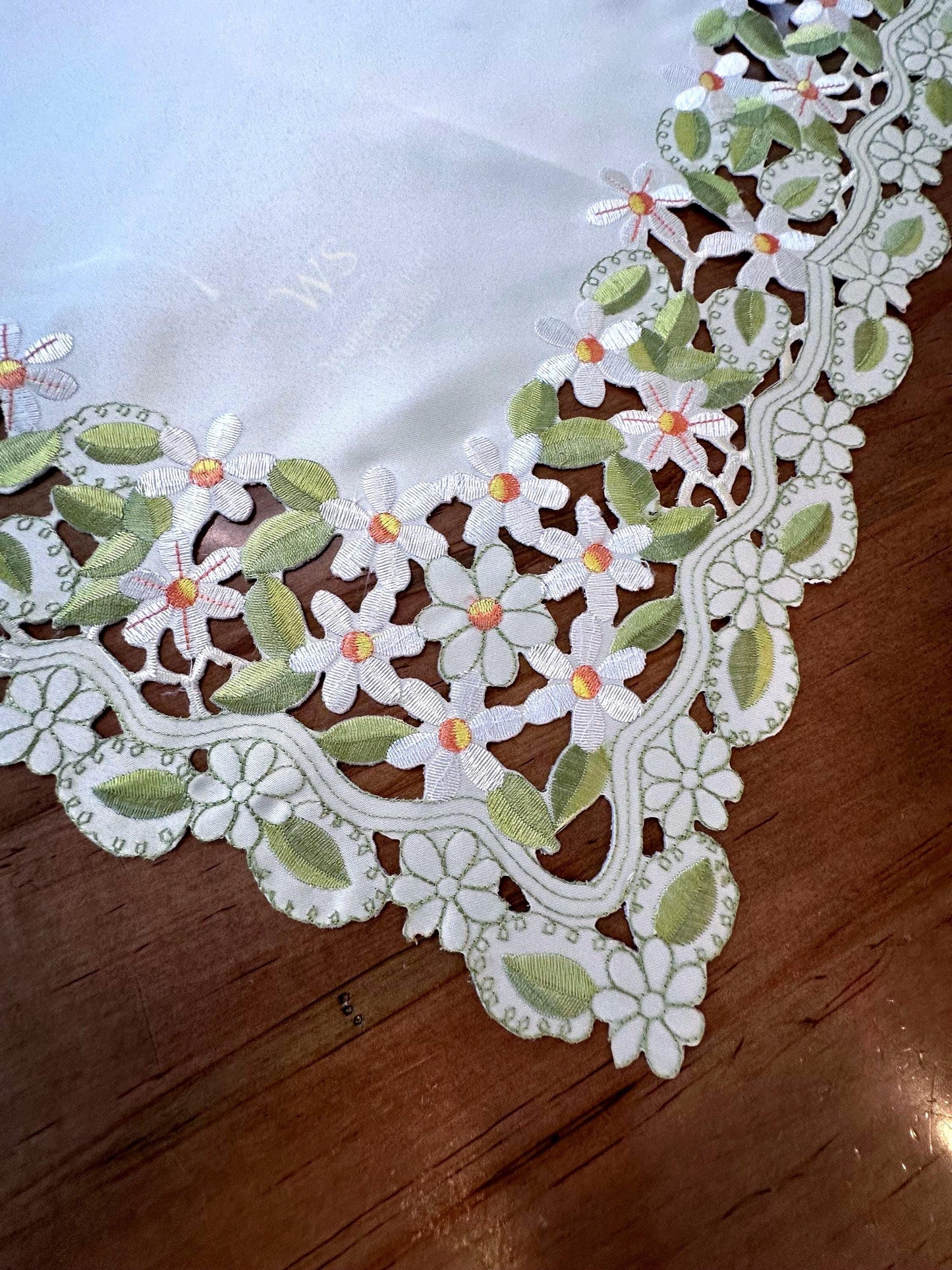 daisy collection of embroidered cutwork.  the perfect  table toppers and runners are the perfect addition to your everyday linens