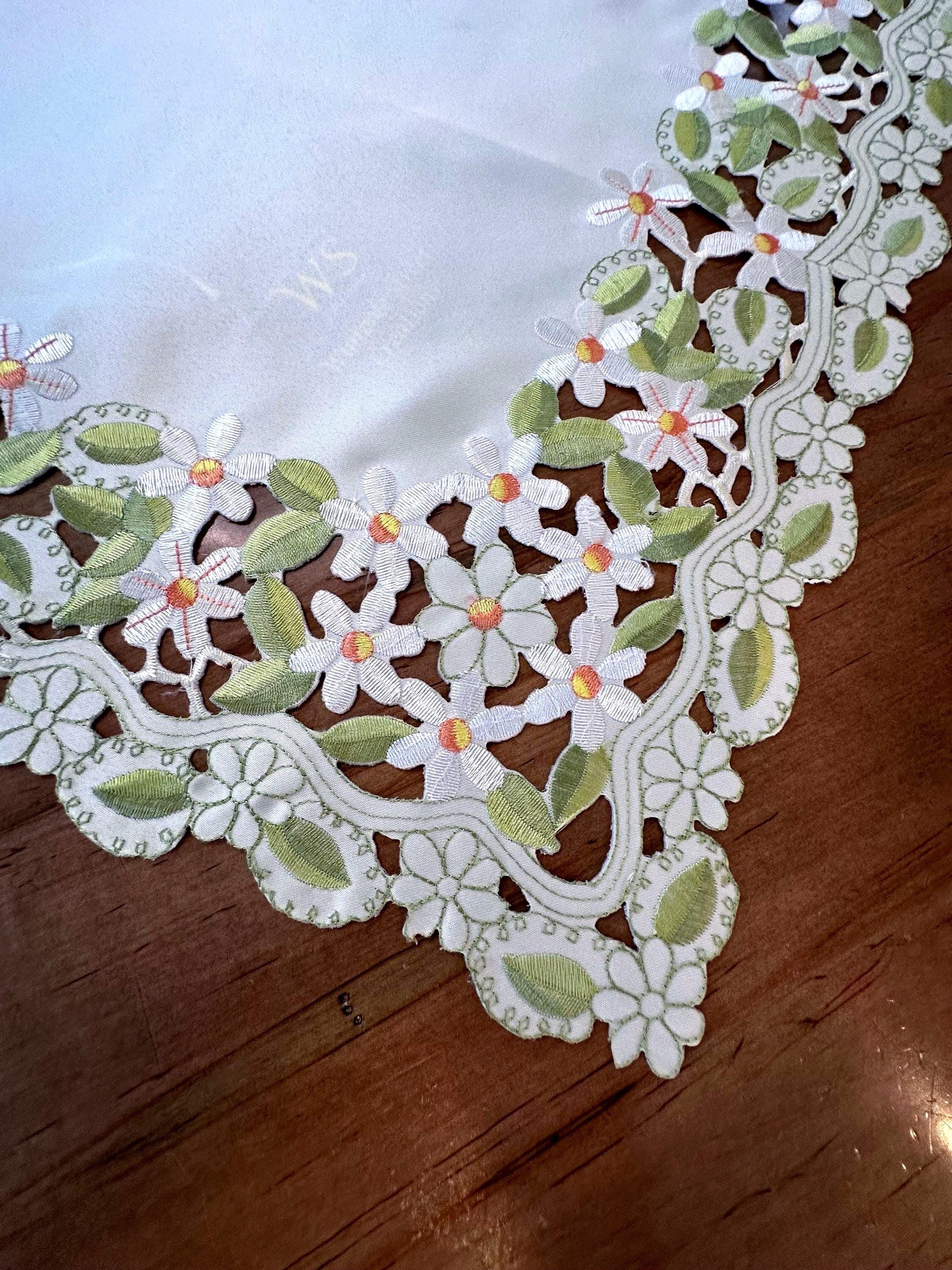 daisy collection of embroidered cutwork.  the perfect  table toppers and runners are the perfect addition to your everyday linens