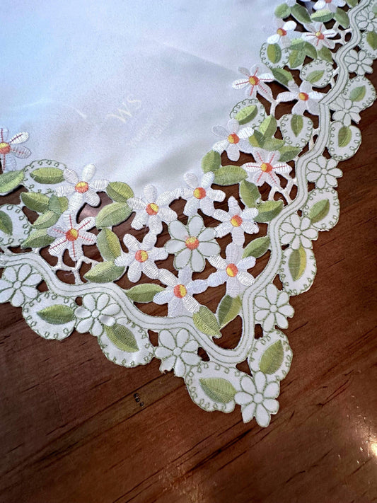daisy collection of embroidered cutwork.  the perfect  table toppers and runners are the perfect addition to your everyday linens