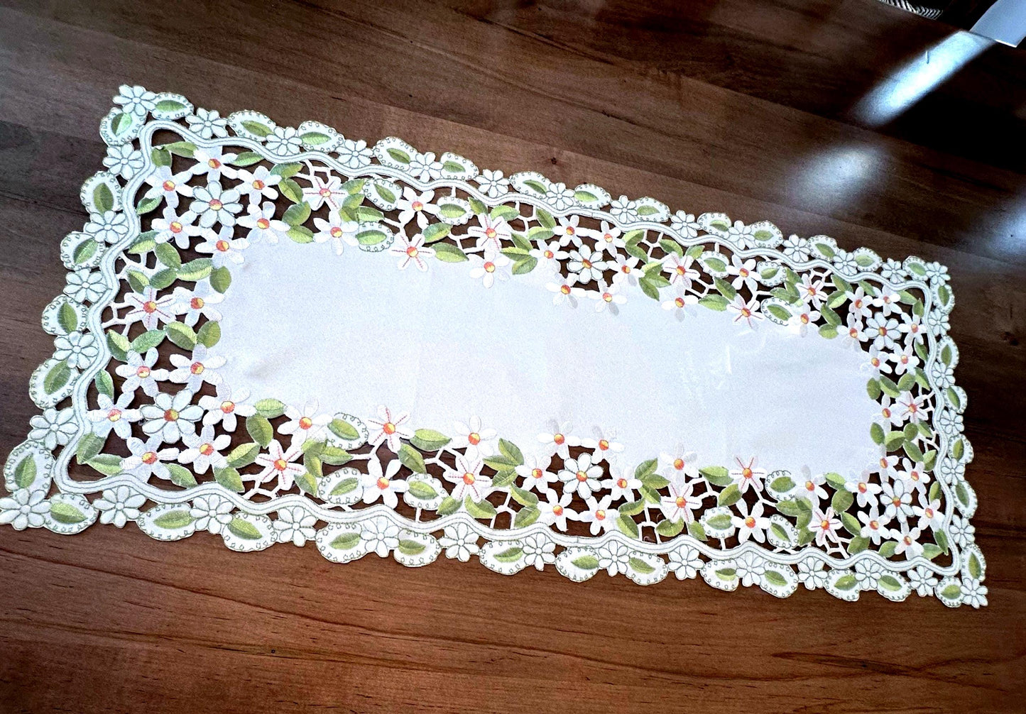 daisy collection of embroidered cutwork.  the perfect  table toppers 15”  x 36” runner is the perfect addition to your everyday linens