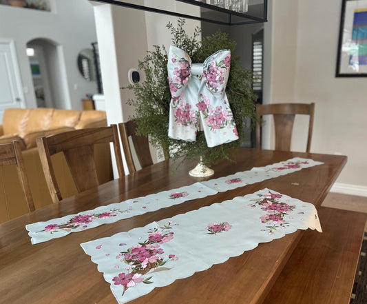 table runners and bow with elegant cherry blossom embroidery on soft blue washable fabric